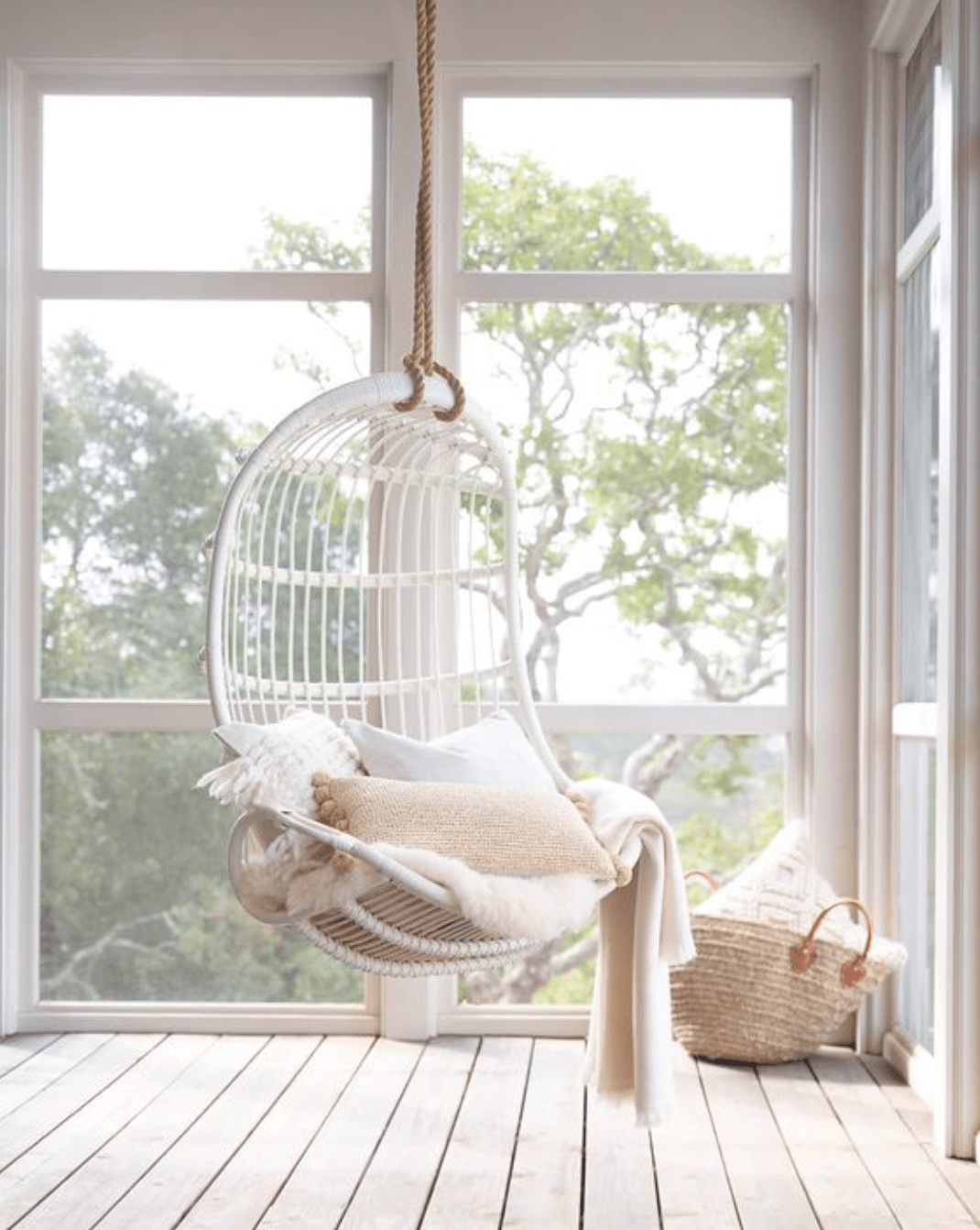 White Hanging Rattan Swing Chair - Handwoven Coastal Home Decor for Relaxing in Style